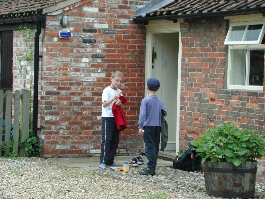 Eric and Kevan outside our door enjoying Cadbury's Fingers