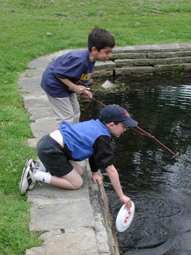 Alec and Kevan fishing for frogs